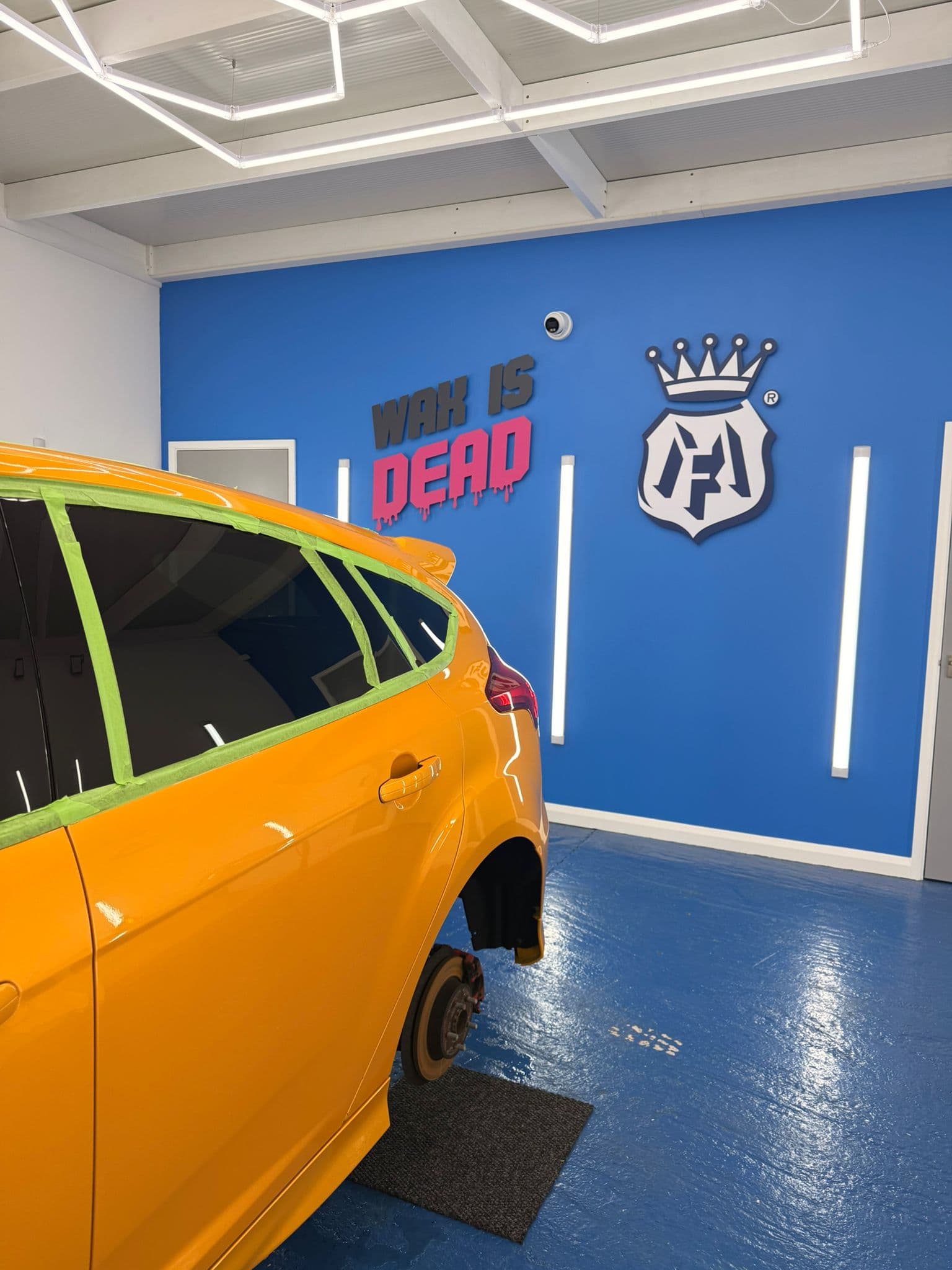 WAX IS DEAD branded feature wall